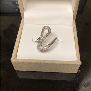 Sterling swirl design ring with pave diamonds.